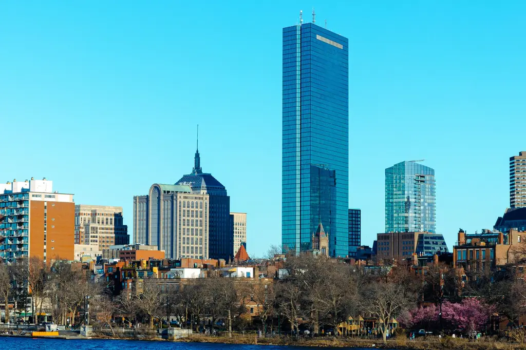 Boston: Stunning view of Boston's skyline featuring the iconic John Hancock Tower and modern architecture.