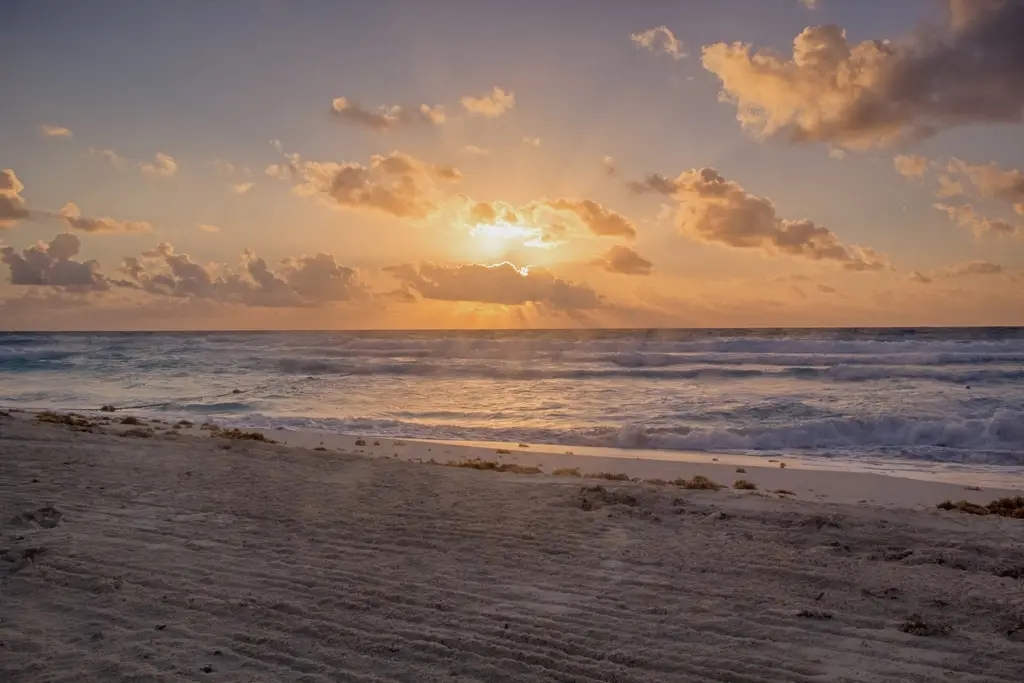 Cancún: Sunrise In Cancún (243462901) 500px provided description: Sunrise over the ocean from the beach in Canc?n, Mexico. [#sky ,#sunrise ,#sea ,#water ,#mexico ,#beac