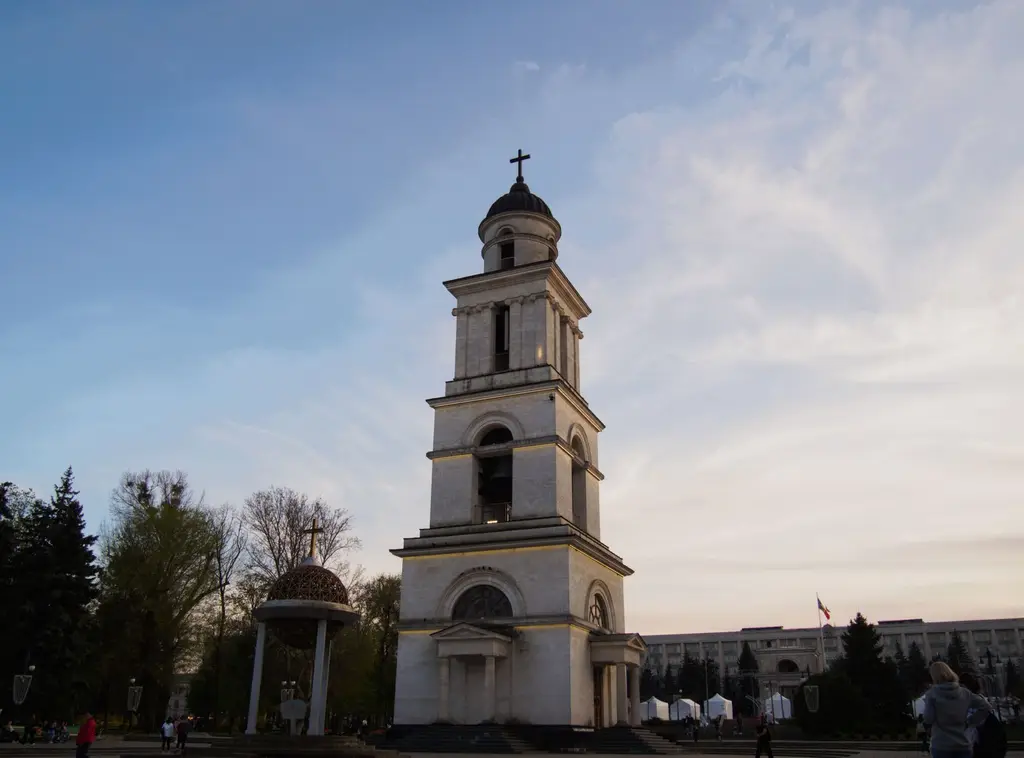 Chișinău: The iconic bell tower in Chișinău's Cathedral Park during a tranquil sunset evening.