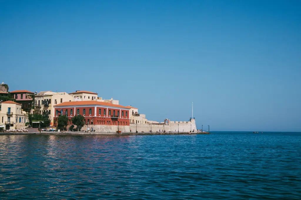 Crete: Picturesque waterfront view of Chania town in Crete, Greece with clear blue skies.