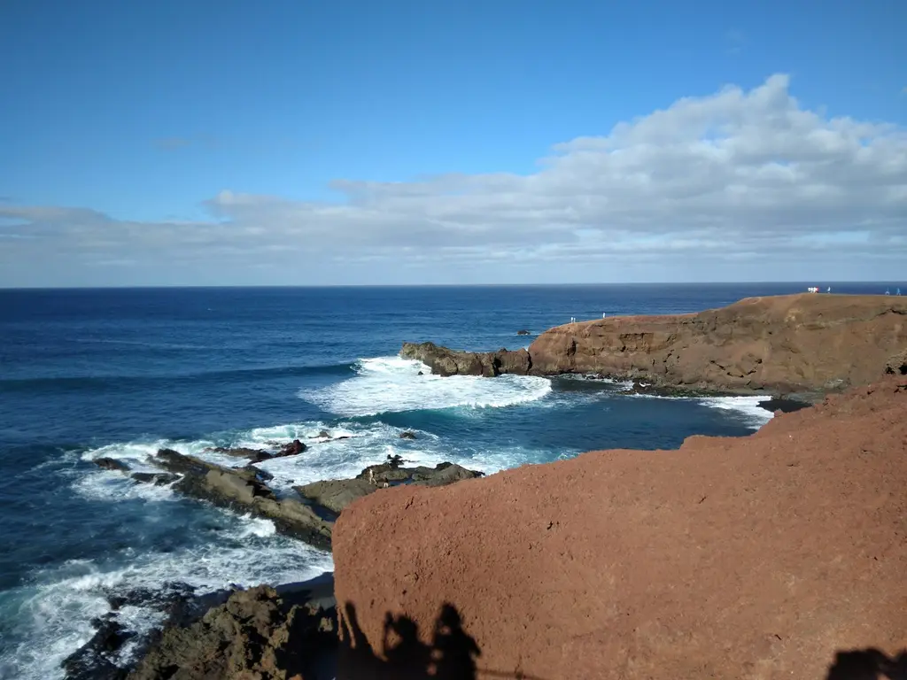 Lanzarote: Coastline of Lanzarote, Canary Islands, Spain, December 2023 a view of the ocean from a rocky cliff
