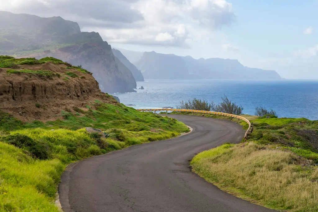 Madeira: The road leading to Ponta de São Lourenço on the Eastern end of the island of Madeira, Portugal. A winding road with a mountain in the background