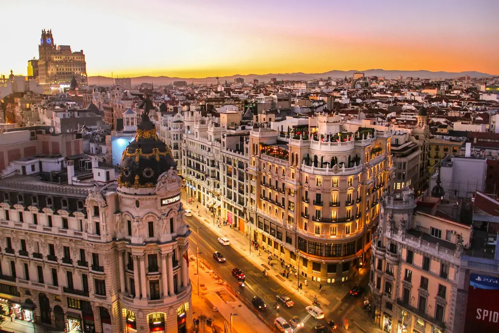 Madrid: Sunset view of Gran Via in Madrid An aerial view of the Metropolis building and Gran Via in Madrid at low sun