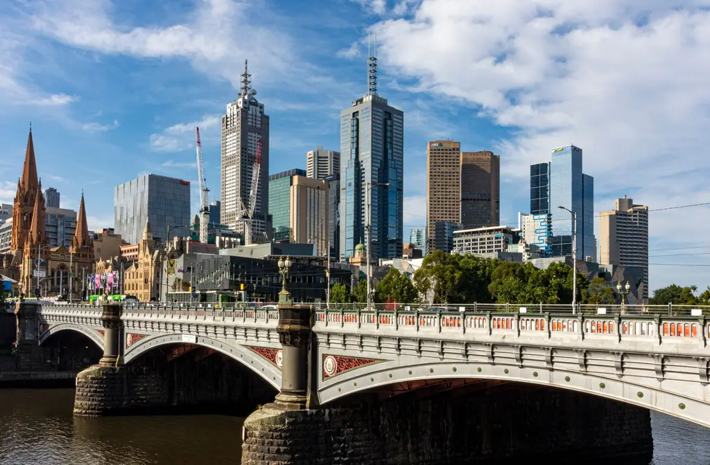 Melbourne: Stunning view of Melbourne's skyline featuring Princes Bridge and Yarra River.