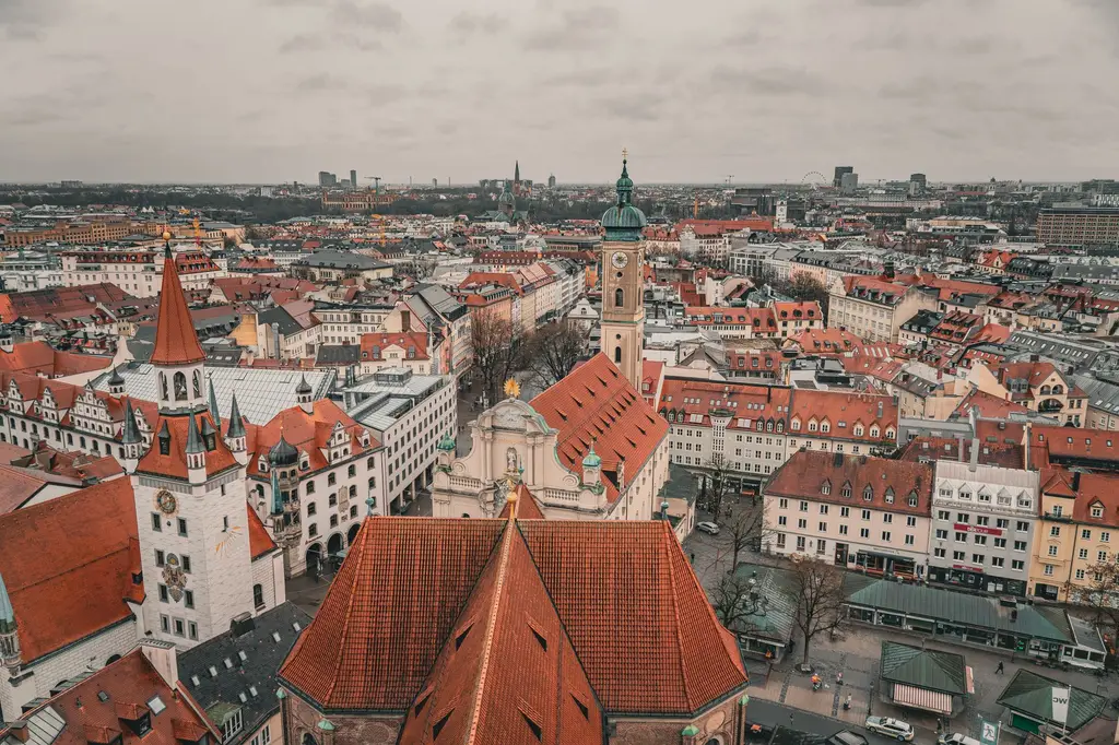 Munich: Aerial photo showcasing the historic architecture and vibrant rooftops of Munich's old town.