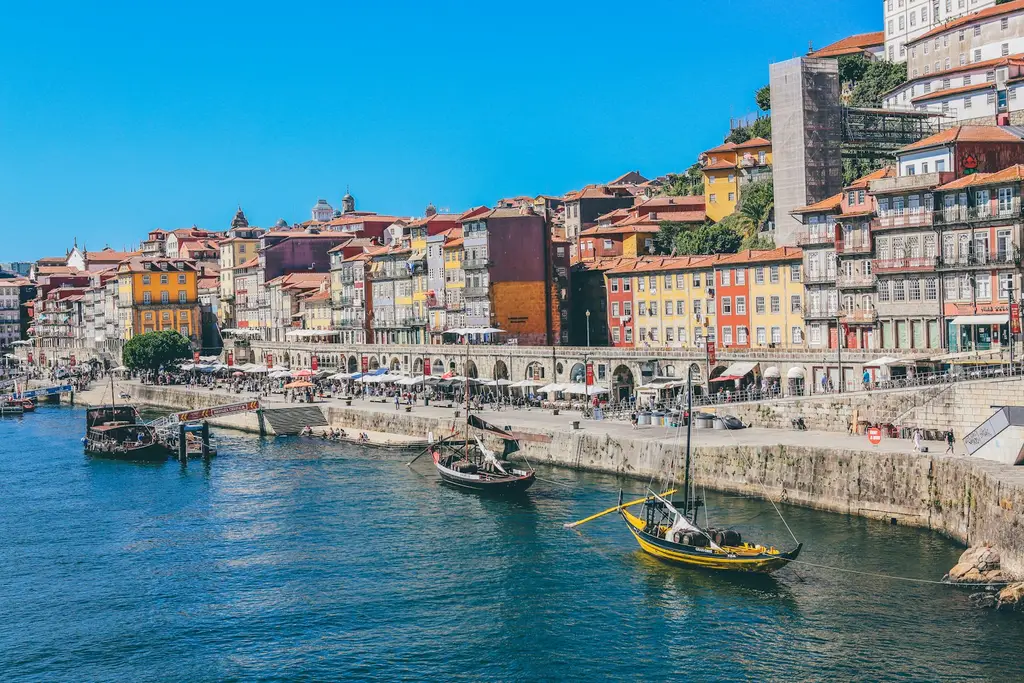 Porto: Porto, Portugal Traditional wooden boats on the Douro River in Porto, Portugal, with colorful buildings